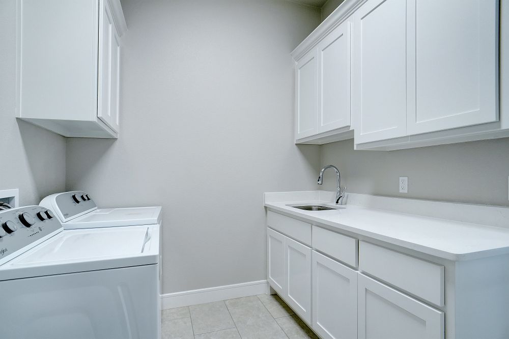 Custom laundry room cabinets by LSC Cabinets